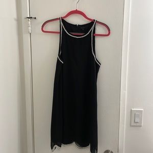 Black dress lined with faux pearls